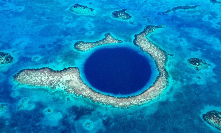 An aerial view of the Great Blue Hole in Belize.
